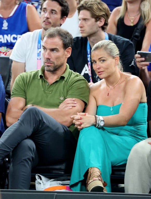 Bruno Cheyrou et Laure Boulleau - Les célébrités assistent à la victoire de l'équipe de France de basket face au Canada (82-73) lors des Jeux Olympiques de Paris2024, le 6 août 2024. © Jacovides-Perusseau / Bestimage 