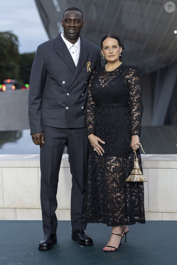 Omar Sy et sa Helene (bijoux Tasaki) - Photocall du dîner "Prelude pour les JO" à la Fondation Vuitton à Paris, France, le 25 juillet 2024. © Olivier Borde/Bestimage 