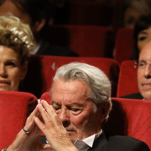 Alain Delon (avec un badge Paris Match d'une ancienne couverture du magazine titrant "Alain Delon, mes deux amours, Rosalie et Anouchka) et sa fille Anouchka (Robe Elie Saab) - Remise de la Palme d'Honneur à Alain Delon lors du 72ème Festival International du Film de Cannes. On may 19th 2019 © Jacovides-Moreau / Bestimage