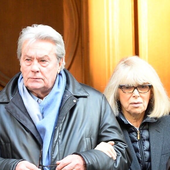 Alain Delon et Mireille Darc - Hommage a Georges Lautner en l'eglise Saint-Roch a Paris. Le 5 decembre 2013