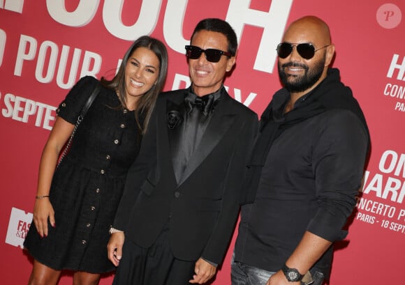 Parmi eux, Teddy Riner, Franck Dubosc et Danièle, Nicoletta et Jean-Christophe Molinier ou encore Nawel Debbouze et son mari Fouad Ben Kouider
Omar Harfouch, Nawel Debbouze et son mari Fouad Ben Kouider au photocall du "concerto pour la paix" de Omar Harfouch au Théâtre des Champs-Elysées à Paris le 18 septembre 2024. © Coadic Guirec / Bestimage 