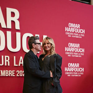 Marc Lavoine et sa compagne Adriana Karembeu au photocall du "concerto pour la paix" de Omar Harfouch au Théâtre des Champs-Elysées à Paris le 18 septembre 2024