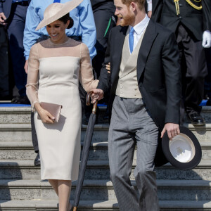 Le prince Harry, duc de Sussex, et Meghan Markle, duchesse de Sussex, lors de la garden party pour les 70 ans du prince Charles au palais de Buckingham à Londres. Le 22 mai 2018 