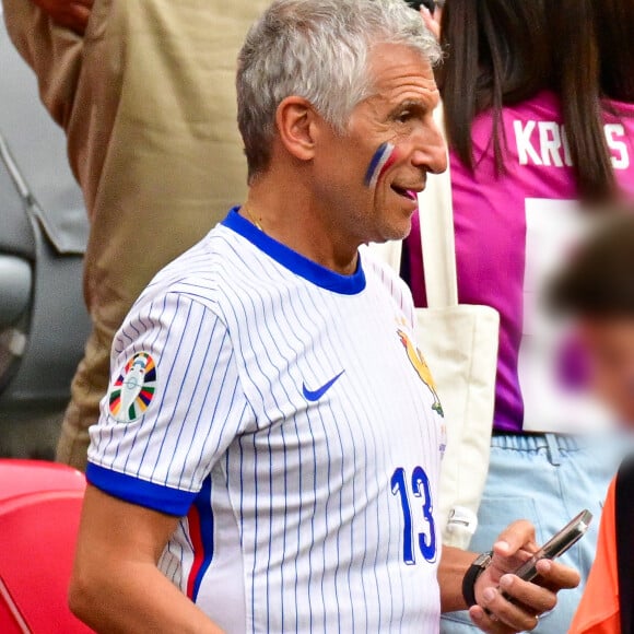 Nagui dans les tribunes de la demi-finale du Championnat d'Europe de football (Euro 2024) entre l'Espagne et la France (2-1) à Munich, Allemagne, le 9 juillet 2024. © Bestimage 