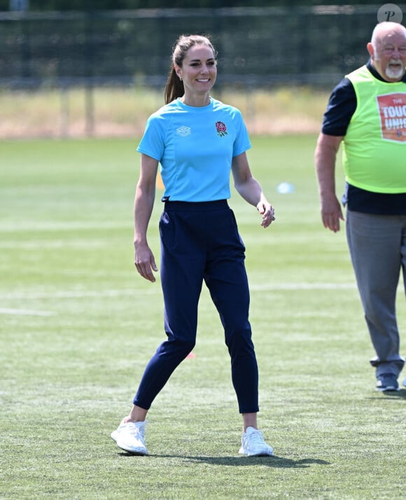 Mais ce qu'elle préfère, par-dessus tout, c'est la course à pied ! 
Catherine Kate Middleton, princesse de Galles, participe à des exercices de rugby lors d'une visite au Maidenhead Rugby Club, dans le Berkshire, le 7 juin 2023.