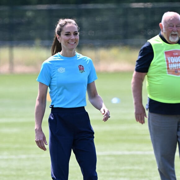 Mais ce qu'elle préfère, par-dessus tout, c'est la course à pied ! 
Catherine Kate Middleton, princesse de Galles, participe à des exercices de rugby lors d'une visite au Maidenhead Rugby Club, dans le Berkshire, le 7 juin 2023.