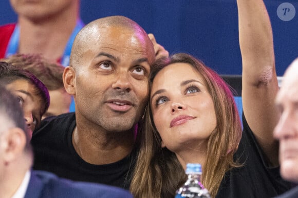 Tony Parker avec son fils Josh et sa compagne Agathe Teyssier - Célébrités assistent à la victoire de Teddy Riner sacré champion Olympique aux épreuves de judo +100KG lors des Jeux Olympiques de Paris 2024 (JO) au Arena Champs de Mars à Paris le 2 aout 2024. © Perusseau-Jacovides/Bestimage