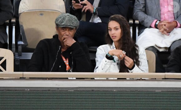 Yannick Noah et sa fille Jenaye Noah - Célébrités dans les tribunes des internationaux de France de Roland Garros à Paris le 30 mai 2022. 