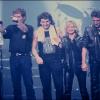 Jean-Jacques Goldman, Johnny Hallyday, Véronique Sanson et Eddy Mitchell lors de la tournée des Enfoirés en 1989.