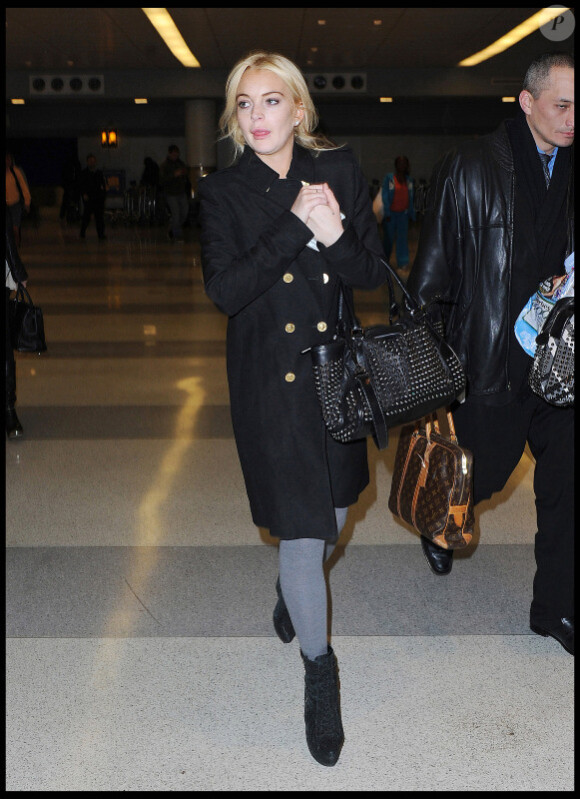 Lindsay Lohan, à l'aéroport JFK à New York, dimanche 13 mars.