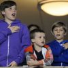 Romeo, Brooklyn et Cruz, la main sur le coeur, suivent l'hymne afin de soutenir leur papa David Beckham lors du match opposant les LA Galaxy au Portland Timbers  au Depot Center de Los Angeles le 23 avril 2011
