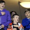 Romeo, Brooklyn et Cruz, la main sur le coeur, suivent l'hymne afin de soutenir leur papa David Beckham lors du match opposant les LA Galaxy au Portland Timbers  au Depot Center de Los Angeles le 23 avril 2011