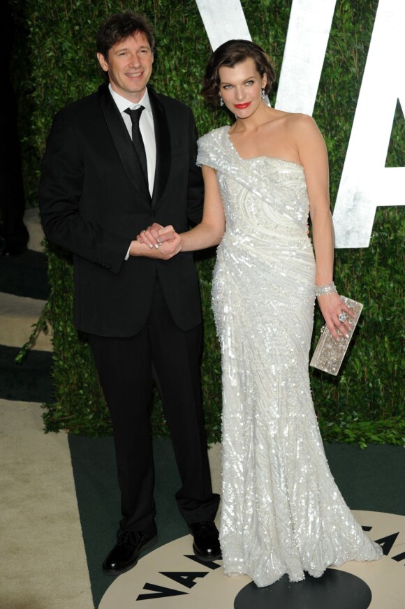 Milla Jovovich et son époux Paul W.S. Anderson à l'after-party des Oscars organisée par le magazine Vanity Fair. Le 26 février 2012