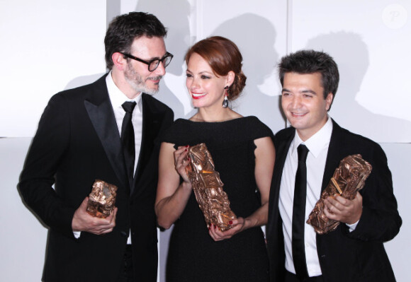 Thomas Langmann lors des César en février 2012, avec Michel Hazanavicius et Bérénice Bejo.