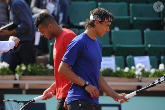 Jo-Wilfried Tsonga et Rafael Nadal le 24 mai 2012 à Roland Garros lors d'un essai pour les nouvelles raquettes intelligentes signées Babolat