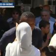 Sandrine Diouf embrasse Marcel Desailly lors des obsèques de Mouss Diouf, le 9 juillet 2012