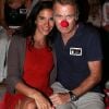 Franck Dubosc (et son nez rouge) ainsi que son épouse Danièle assistent au spectacle de Jean-Marie Bigard au Théâtre de la Verdure à Ramatuelle, le mardi 10 juillet 2012, dans le cadre du festival Les Arts du Rire.