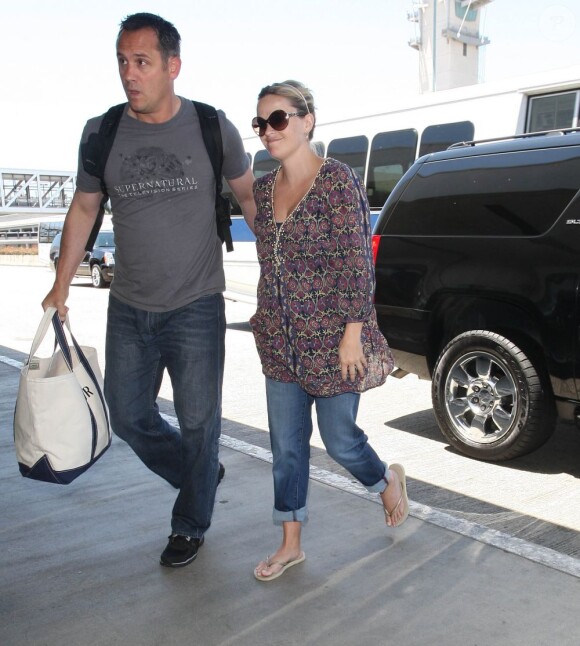 Reese Witherspoon et son mari Jim Toth à Los Angeles, le 15 juillet 2012.