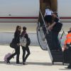 Anne Hathaway et Christian Bale quittant, depuis l'aéroport du Bourget, la France le 21 juillet 2012 après l'annulation de la promotion du film The Dark Knight Rises. Il s'agit d'une conséquence directe de la fusillade qui a eu lieu dans le Colorado durant une avant-première du film