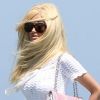 Zahia Dehar arrive cheveux au vent telle une vraie star sur la plage du Club 55 à Saint-Tropez le 26 juillet 2012