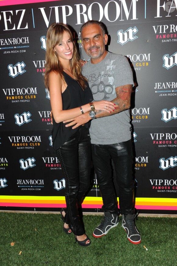 Christian Audigier et sa compagne Nathalie font la fête au VIP Room de Jean-Roch, le samedi 28 juillet 2012. Le styliste y lançait sa marque Lady Baltimore.