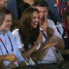 Kate Middleton le 9 août 2012 à l'ExCel Centre au côté de la princesse Anne et son époux Timothy Lawrence lors de la victoire de la boxeuse britannique Nicola Adams en finale du tournoi olympique aux JO de Londres.