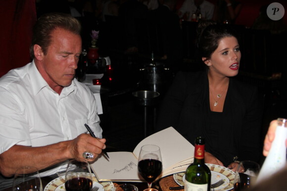 Arnold Schwarzenegger et sa fille Katherine lors de l'after-party au Buddha Bar de la projection d'Expendables 2 à Paris le 9 août 2012