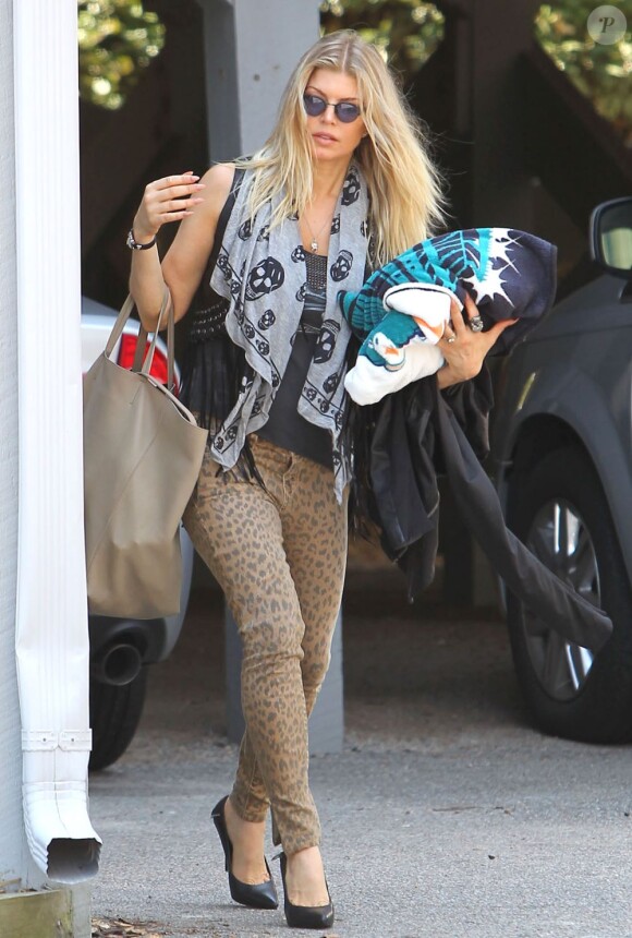 Fergie se rend à l'aéroport de Wilmington le 14 août 2012