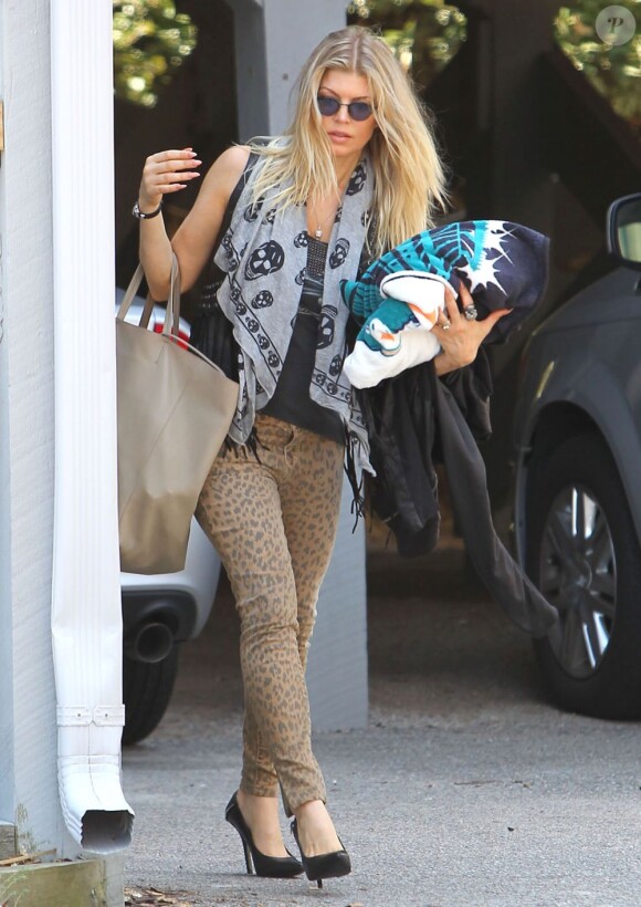 Fergie se rend à l'aéroport de Wilmington le 14 août 2012