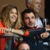 Michaël Youn et Isabelle Funaro lors du match de Ligue des champions entre le PSG et le Dynamo Kiev (4-1) le 18 septembre 2012 au Parc des Princes à Paris