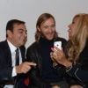 David et Cathy Guetta rencontrent le PDG de Renault, au Mondial de l'Auto 2012 à Paris, le jeudi 27 septembre 2012.