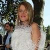 Anna Dello Russo, habillée d'une robe Alexander McQueen, arrive au défilé Céline printemps-été 2013. Paris, le 30 septembre 2012.