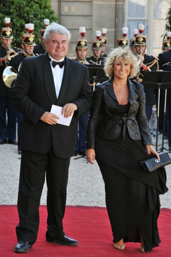 Eric Raoult et sa femme à L'Elysée, le 22 juin 2009.
