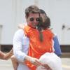 Tom Cruise s'apprête à prendre l'hélicoptère avec sa fille Suri, le 18 juillet 2012.