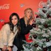Elise Chassaing et Enora Malagré lors de l'inauguration des vitrines de Noël Coca-Cola au Showcase à Paris le 26 Novembre 2012