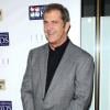 Mel Gibson arbore le sourire pendant la soirée de charité Mending Kids International où était organisé un tournoi de poker entre stars, à Los Angeles, le 1er décembre 2012.