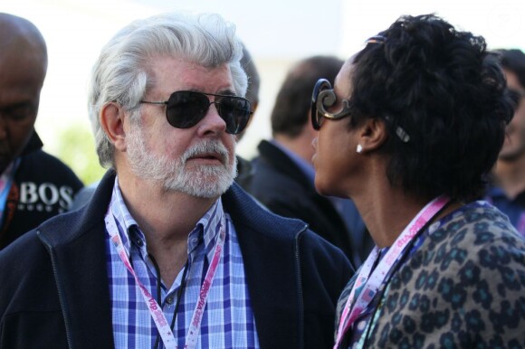 George Lucas nage dans le bonheur avec sa femme businesswoman Mellody Hobson sur paddock du circuit d'Austin, le 17 novembre 2012.