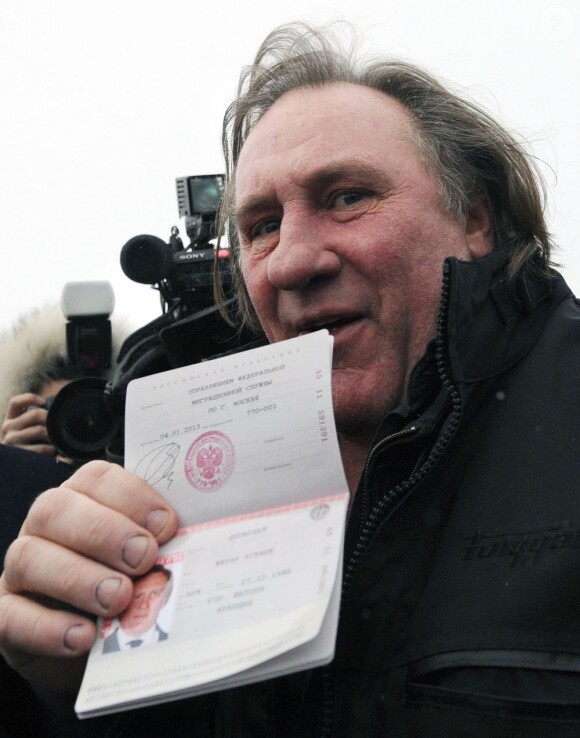 French actor Gerard Depardieu shows off his Russian passport during a visit to Saransk with Mordovia's head Vladimir Volkov in Saransk, Russia on January 6, 2013. Photo by Stanislav Krasilnikov/Itar-Tass/ABACAPRESS.COM07/01/2013 - Saransk