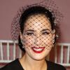 Dita von Teese souriante derrière sa voilette lors du défilé haute couture printemps-été 2013 d'Alexis Mabille à la mairie du IVeme arrondissement. Paris, le 21 janvier 2013.