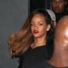 Rihanna, sublime, quitte le Playhouse, une boîte de nuit de Los Angeles, au bras de son amie Melissa, le 24 janvier 2013. Rihanna arbore une robe très courte noire transparente sans soutien-gorge sur de somptueux talons.