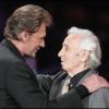 Johnny Hallyday et Charles Aznavour à Paris, le 12 janvier 2005. 
