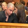 Carl et Aimee Pistorius, frère et soeur d'Oscar Pistorius, au tribunal de Pretoria le 22 février 2013, jour de la libération sous caution de l'athlète handisport, inculpé du meurtre de sa compagne Reeva Steenkamp, perpétré la nuit de la Saint Valentin.