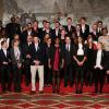 François Hollande et Valérie Trierweiler entourés par les athlètes lors de la cérémonie de remise de la Légion d'honneur aux sportifs médaillés à Londres lors des Jeux olympiques, au palais de l'Elysée le 1er mars 2013 à Paris