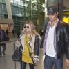 La chanteuse Fergie (enceinte) et son mari Josh duhamel arrivent a l'aéroport Heathrow de Londres, le 19 fevrier 2013.