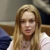 Lindsay Lohan, mal en point, lors de son procès devant la cour de justice de Los Angeles, le 18 mars 2013. L'actrice de 26 ans, accompagnée de son avocat Mark Heller, a échappé à la prison mais pas à la cure de rehab.
