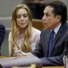 Lindsay Lohan lors de son procès devant la cour de justice de Los Angeles, le 18 mars 2013. L'actrice de 26 ans, accompagnée de son avocat Mark Heller, a échappé à la prison mais pas à la cure de rehab.