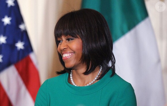 Michelle Obama, souriante à la Maison Blanche à l'occasion d'un dîner d'Etat le 19 mars 2013