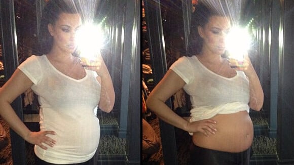 Kim Kardashian enceinte : Elle soulève le haut et dévoile son baby-bump