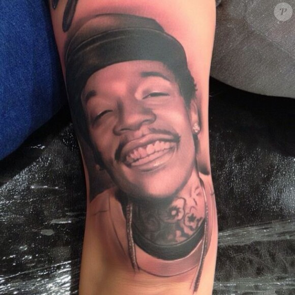 Amber Rose s'est fait tatouer sur le bras le portrait de son fiancé Wiz Khalifa avec qui elle a un enfant, le petit Sebastian.
