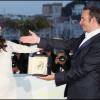 Jean Dujardin récompensé et Bérénice Bejo à photocall suivant la remise des prix au Festival de Cannes 2011.